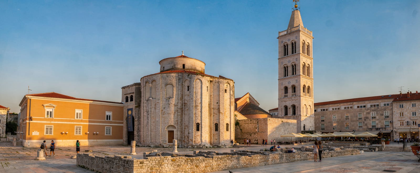 The stone facades of Zadar's Old Town and the Sea Organ steps, photographed from the Riva on a clear morning.